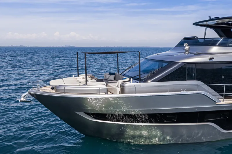 Slide: The Image of 2026 Cranchi Sessantasette 67 yacht cruising on open sea, sleek design, luxurious deck. - 8