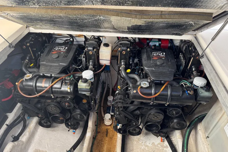 Slide: The Image of 2007 Sea Ray 290 Amberjack cockpit with steering wheel, seating, and control panel. - 13