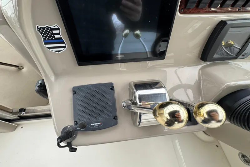Slide: The Image of Control panel of a 2007 Sea Ray 290 Amberjack boat with Garmin display and Northstar speaker. - 18