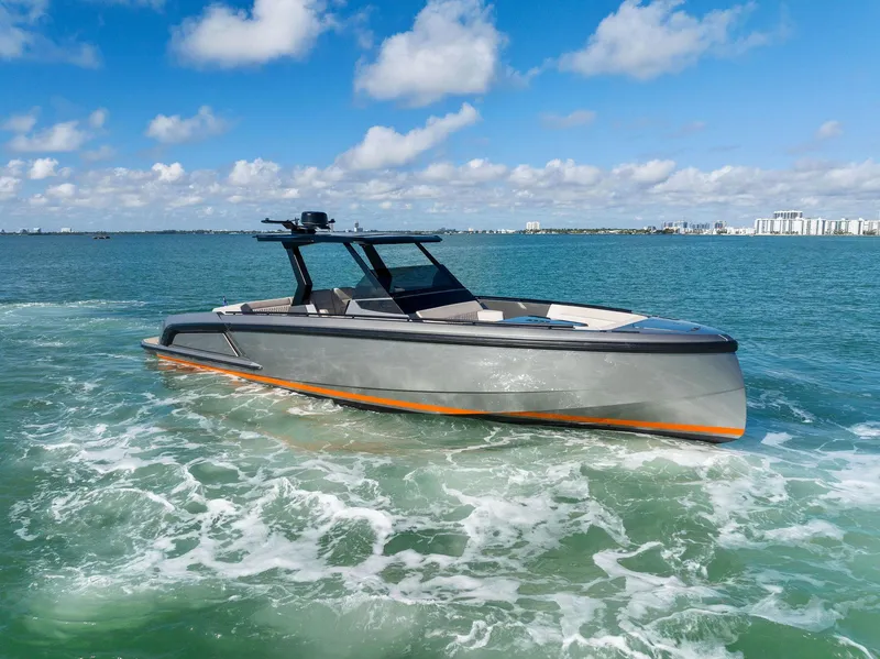 Slide: The Image of Vanquish Yachts VQ40 2022 cruising on clear blue waters under a sunny sky. - 0