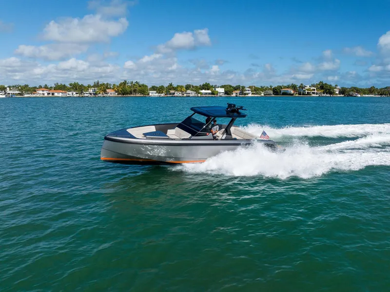 Slide: The Image of Vanquish Yachts VQ40 2022 cruising on a sunny day in open water. - 1