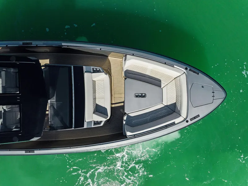 Slide: The Image of Aerial view of 2022 Vanquish Yachts VQ40 on vibrant green water. - 10
