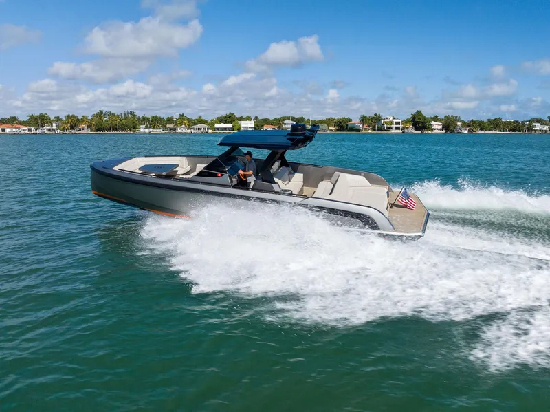 Slide: The Image of 2022 Vanquish Yachts VQ40 cruising on a sunny day, showcasing sleek design and performance. - 13