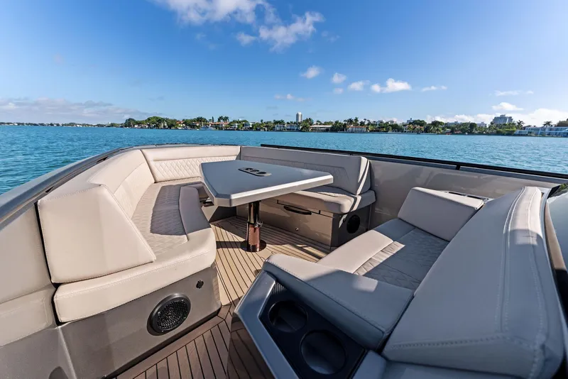 Slide: The Image of Luxurious 2022 Vanquish Yachts VQ40 interior with elegant seating and table on open water. - 19