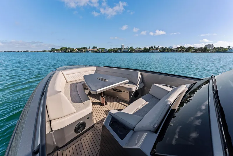 Slide: The Image of Luxurious 2022 Vanquish Yachts VQ40 with elegant seating on serene waters. - 20