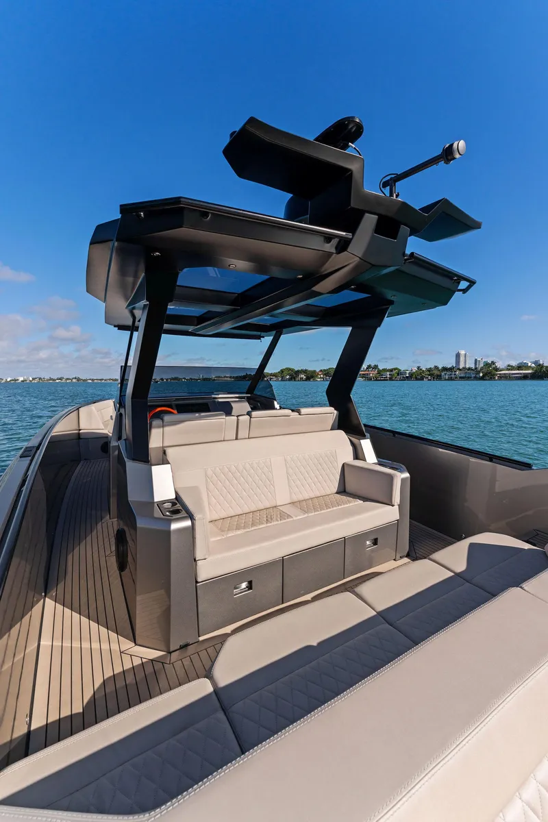 Slide: The Image of 2022 Vanquish Yachts VQ40 luxury boat with sleek design on open water. - 29