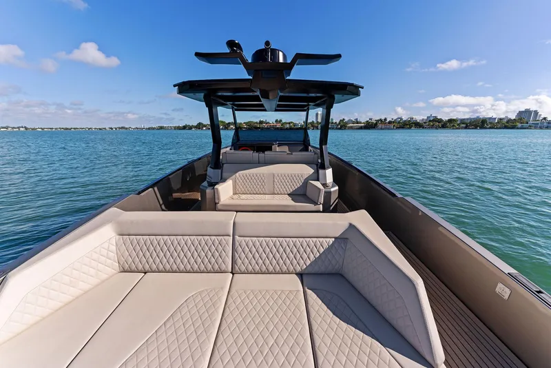 Slide: The Image of Vanquish Yachts VQ40 2022 luxury boat with spacious seating on calm water. - 37