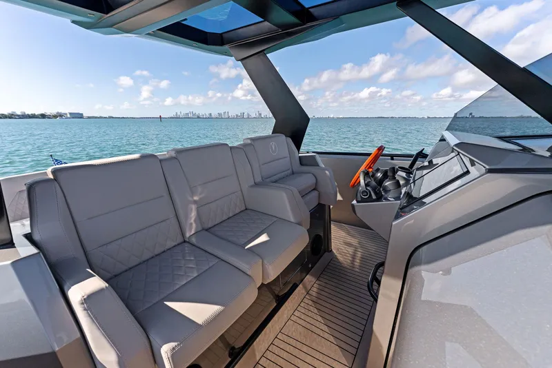 Slide: The Image of Luxurious 2022 Vanquish Yachts VQ40 interior with plush seating and modern helm on open water. - 41
