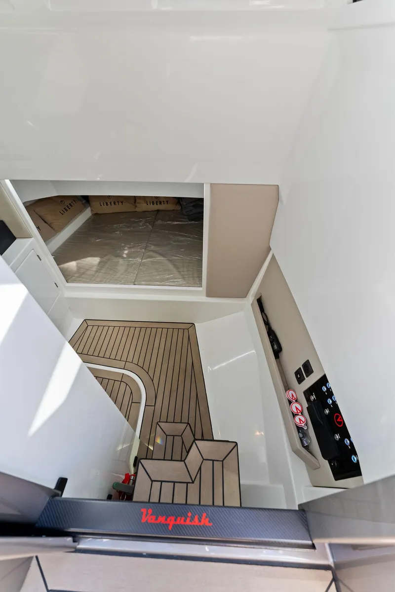 Slide: The Image of Interior view of 2022 Vanquish Yachts VQ40 with modern design and wood flooring. - 44