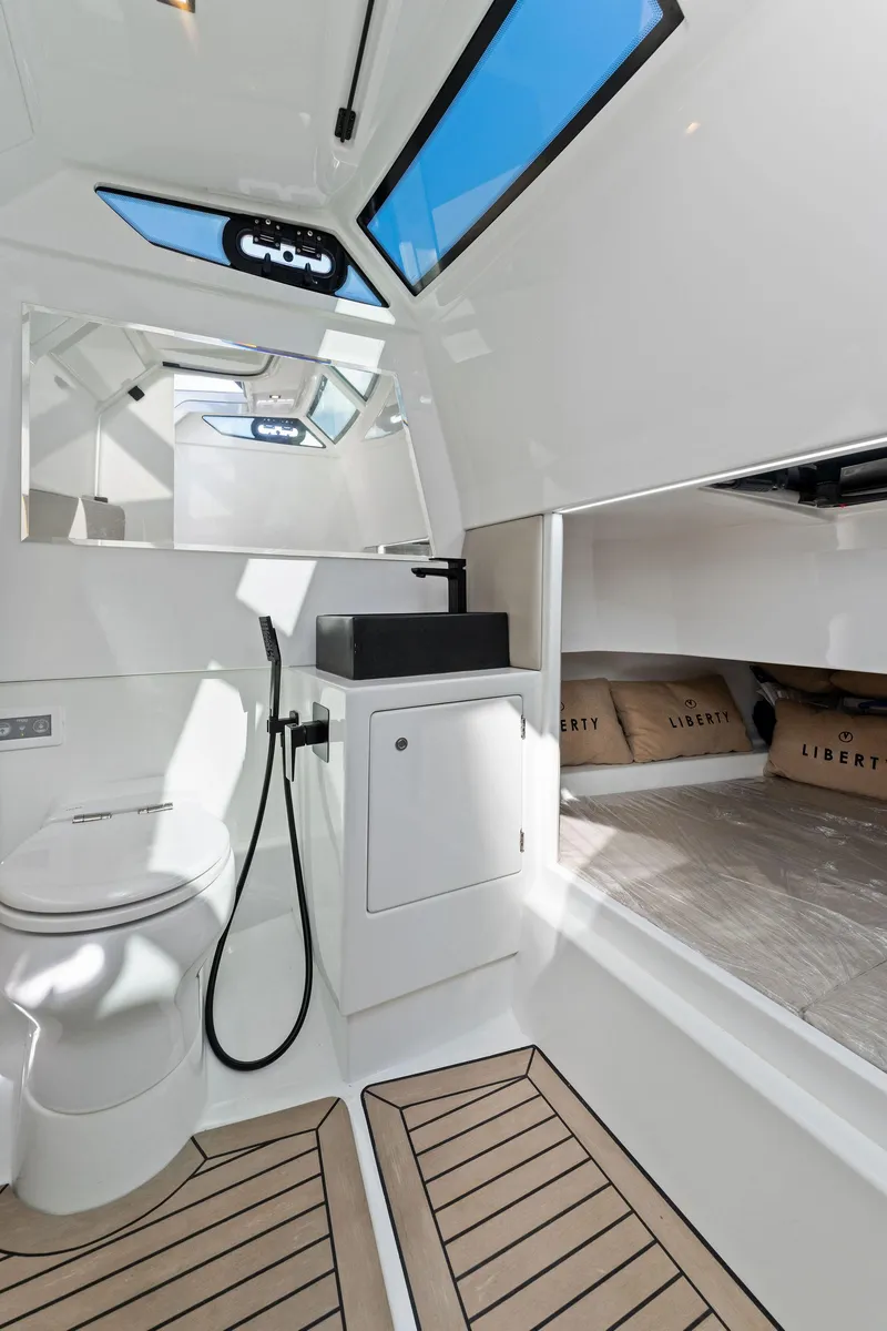 Slide: The Image of Luxurious 2022 Vanquish Yachts VQ40 interior with modern bathroom and sleek design. - 47
