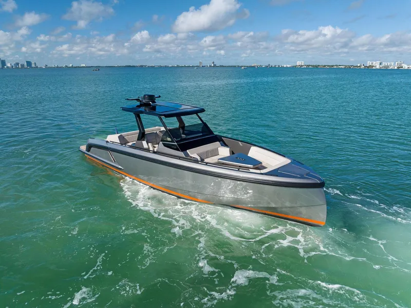 Slide: The Image of 2022 Vanquish Yachts VQ40 cruising on clear blue waters under a sunny sky. - 5