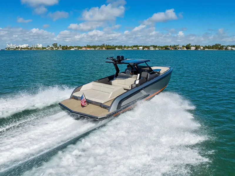 Slide: The Image of Vanquish Yachts VQ40 2022 cruising on open water, showcasing sleek design and performance. - 8