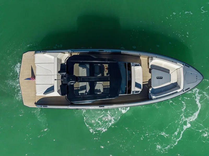 Slide: The Image of Aerial view of 2022 Vanquish Yachts VQ40 on green water. - 9