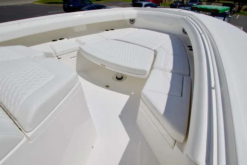 Slide: The Image of Luxurious seating area on 2026 Regulator 37 boat, featuring white cushioned seats. - 10