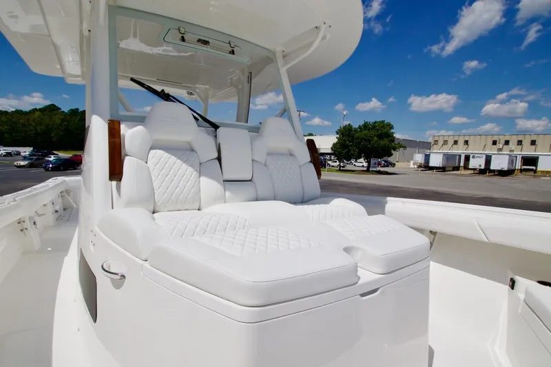 Slide: The Image of Luxurious seating on 2026 Regulator 37 boat under clear blue sky. - 11