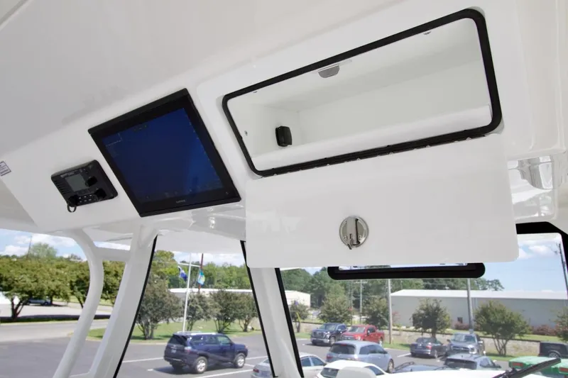 Slide: The Image of 2026 Regulator 37 boat interior with electronic display and storage compartment. - 18