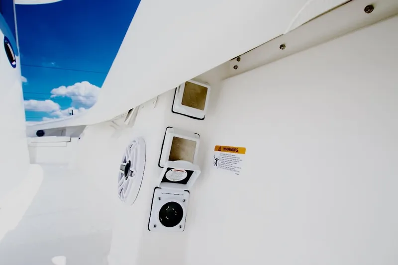 Slide: The Image of 2026 Regulator 37 boat interior with speaker and warning label. - 19