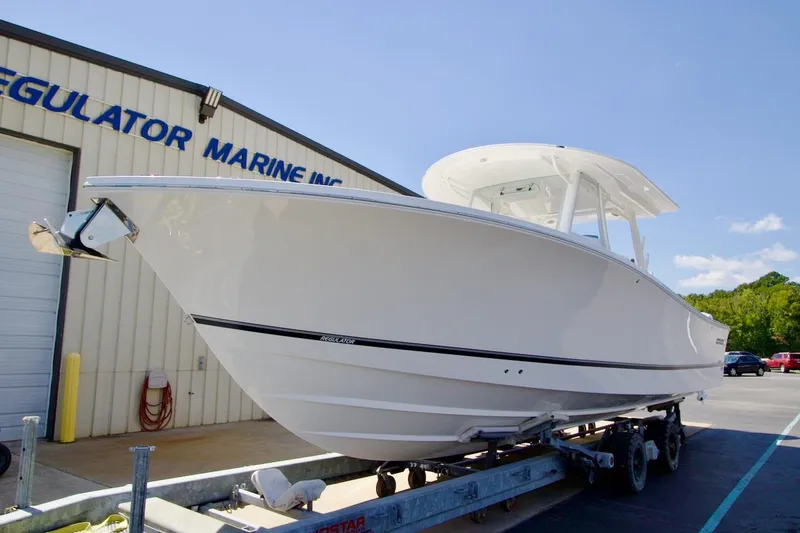 Slide: The Image of 2026 Regulator 37 boat on trailer at Regulator Marine facility. - 23