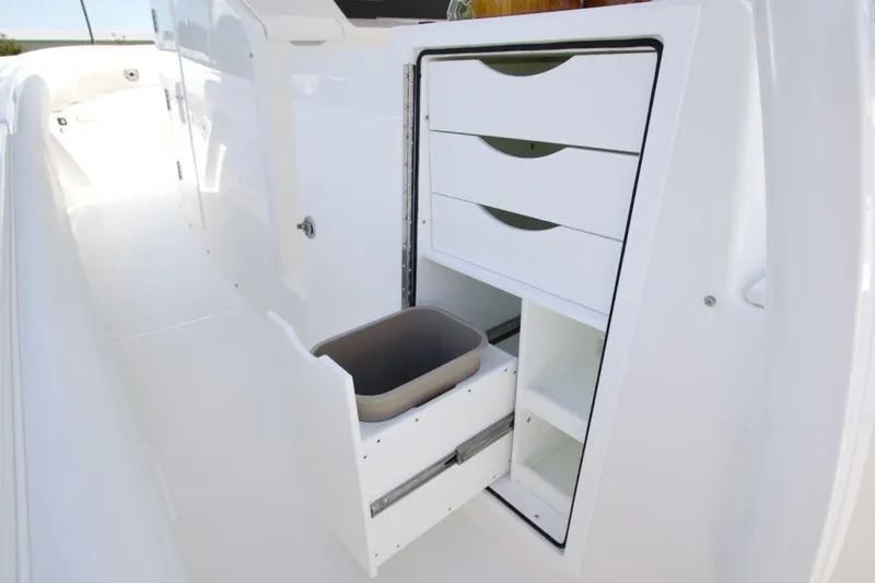 Slide: The Image of 2026 Regulator 37 boat interior with open storage drawers and compartments. - 7