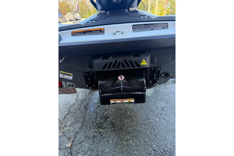 Slide: The Image of 2021 Seadoo GTI90 rear view showing jet propulsion system and warning labels. - 11