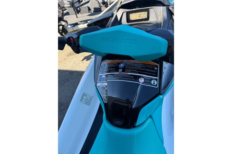 Slide: The Image of 2021 Seadoo GTI90 jet ski dashboard with turquoise handlebars and display screen. - 12