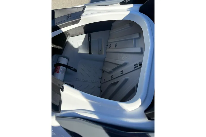 Slide: The Image of Interior storage compartment of 2021 Seadoo GTI90 watercraft, featuring a fire extinguisher. - 16