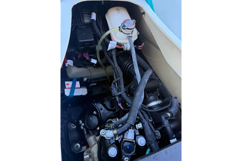 Slide: The Image of 2021 Seadoo GTI90 engine compartment with visible components and wiring. - 18