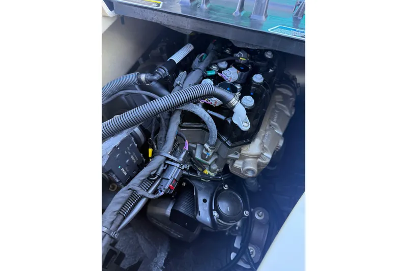 Slide: The Image of 2021 Seadoo GTI90 engine compartment with visible wiring and components. - 19