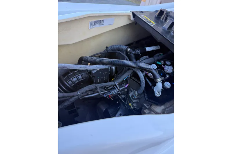 Slide: The Image of Engine compartment of a 2021 Seadoo GTI90, showcasing wiring and components. - 21