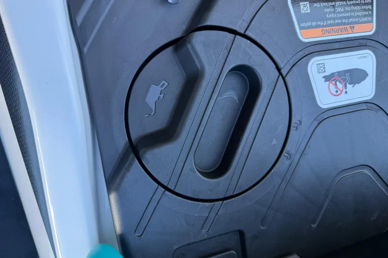 Slide: The Image of 2021 Seadoo GTI90 fuel cap with warning labels and safety instructions. - 22