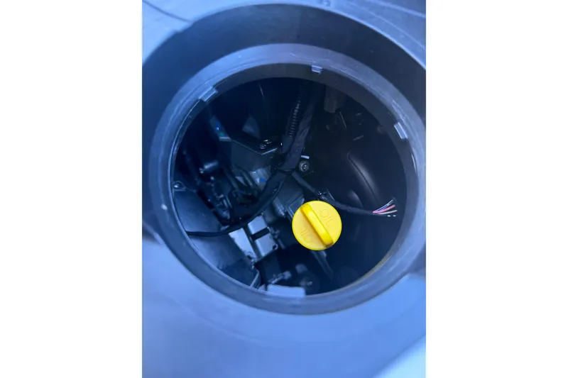 Slide: The Image of 2021 Seadoo GTI90 engine compartment with visible yellow oil cap. - 23
