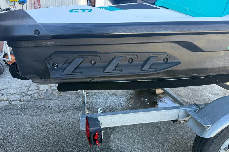 Slide: The Image of 2021 Seadoo GTI90 jet ski on trailer, side view showing hull details. - 25