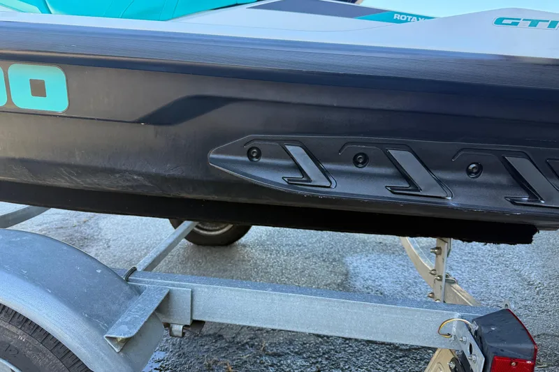 Slide: The Image of 2021 Seadoo GTI90 jet ski on a trailer, showcasing hull design and branding. - 26