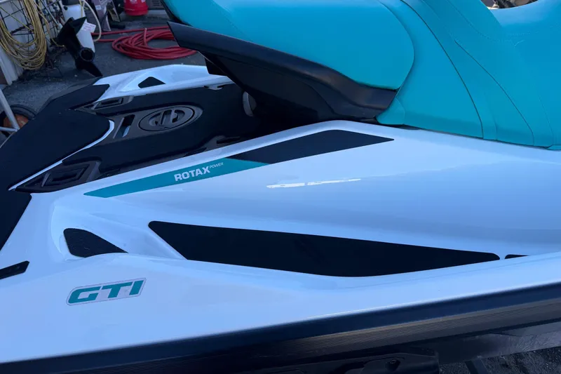 Slide: The Image of 2021 Seadoo GTI90 jet ski with turquoise seat and Rotax engine branding. - 3