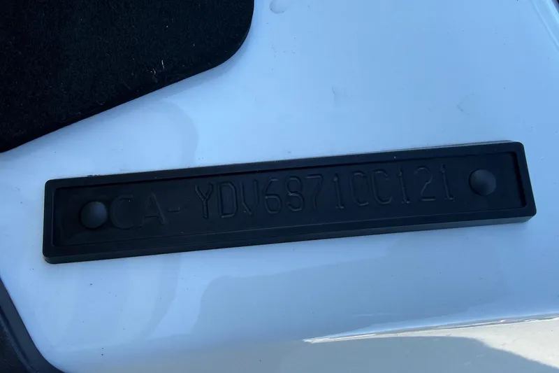 Slide: The Image of 2021 Seadoo GTI90 hull identification number on white surface. - 5