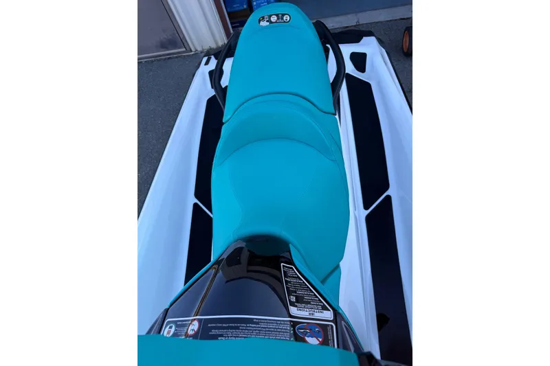 Slide: The Image of 2021 Seadoo GTI90 jet ski with teal seat and sleek design. - 8