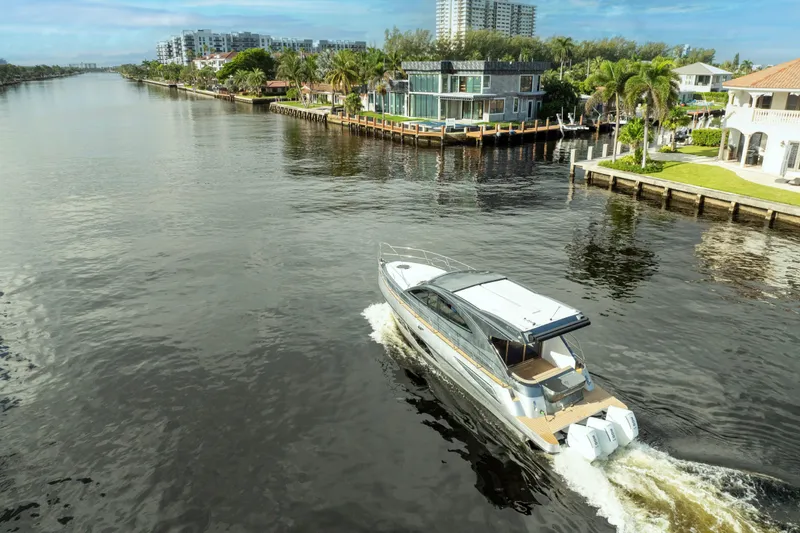 Slide: The Image of Luxury Valiatt 410HT yacht cruising a scenic canal, 2025 model. - 16