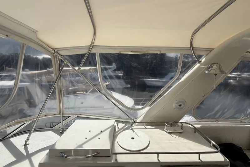 Slide: The Image of Interior view of 2004 Navigator 4800 yacht with clear windows and metal framework. - 12
