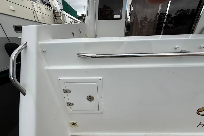 Slide: The Image of 2004 Navigator 4800 yacht deck with railing and access panel. - 20