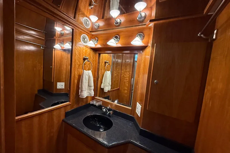 Slide: The Image of Luxurious wooden bathroom interior of 2004 Navigator 4800 yacht with elegant lighting. - 36