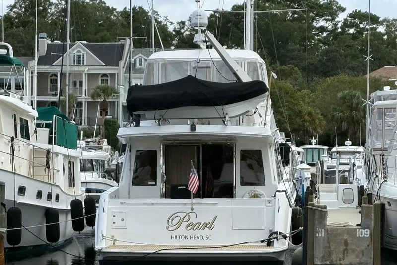 Slide: The Image of 2004 Navigator 4800 yacht named "Pearl" docked in Hilton Head, SC marina. - 5