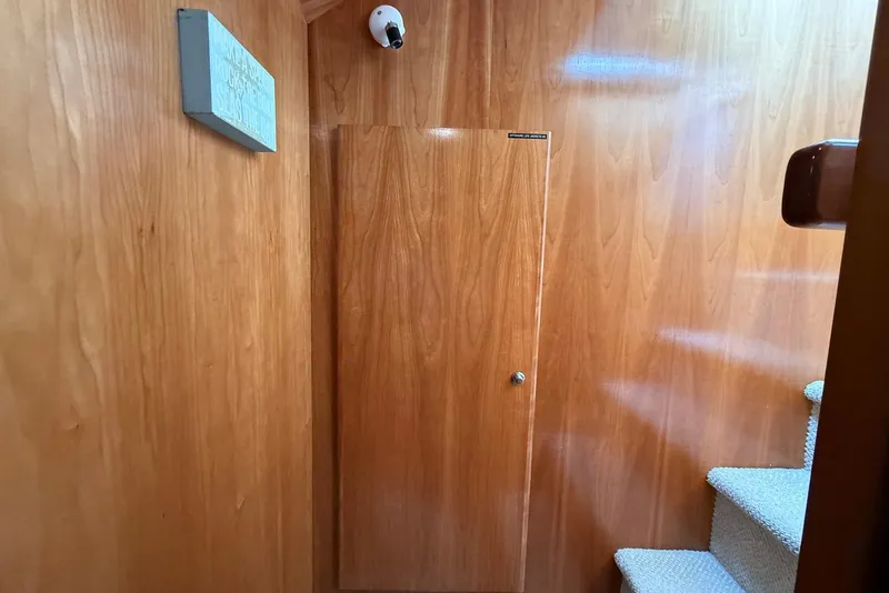 Slide: The Image of Wood-paneled interior of 2004 Navigator 4800 yacht with stairs and door. - 50