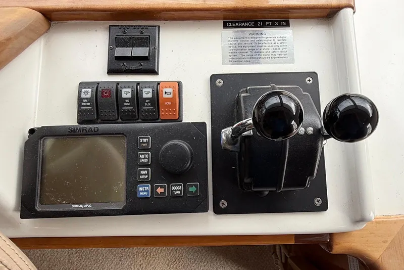 Slide: The Image of Control panel of 2004 Navigator 4800 boat with Simrad AP20 autopilot system. - 56