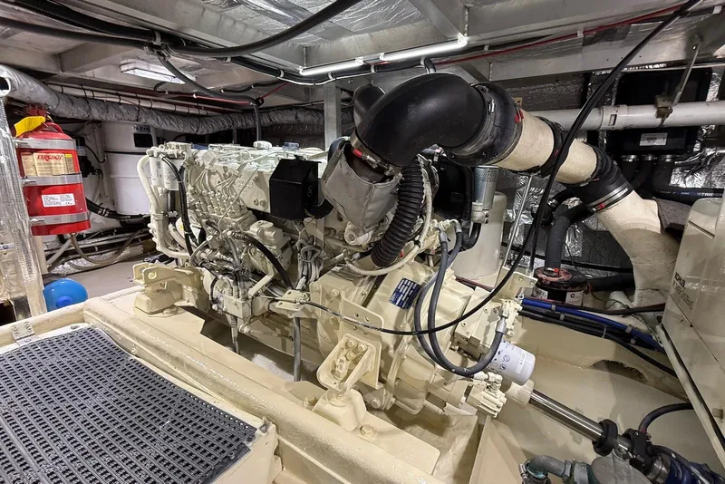 Slide: The Image of Engine room of a 2004 Navigator 4800 yacht, showcasing detailed machinery and components. - 72