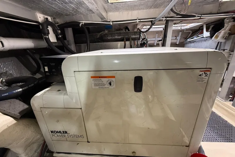 Slide: The Image of Kohler Power Systems generator in a 2004 Navigator 4800 engine room. - 75