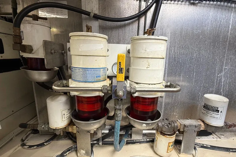 Slide: The Image of Diesel fuel filter system in a 2004 Navigator 4800 engine compartment. - 76