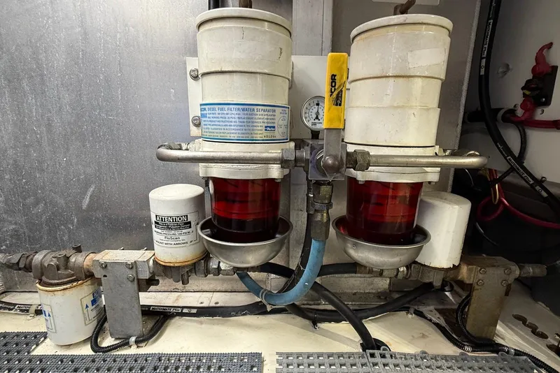 Slide: The Image of 2004 Navigator 4800 diesel fuel filter water separator system in engine room. - 78