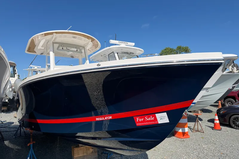 The Image of 2025 Regulator 26XO boat for sale, displayed outdoors under clear blue sky. - 8
