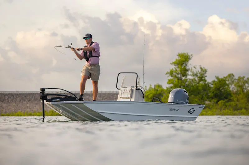 Slide: The Image of Man fishing on a 2026 G3 Bay 17 boat in a scenic water setting. - 21