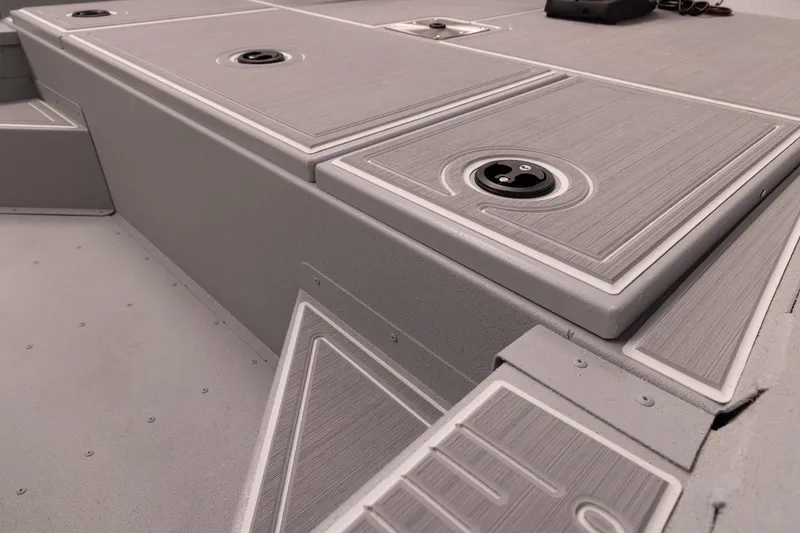 Slide: The Image of 2026 G3 Bay 17 boat deck with storage compartments and sleek design. - 23